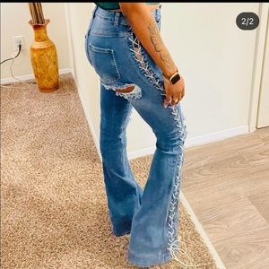 Laced up ripped flare jeans
